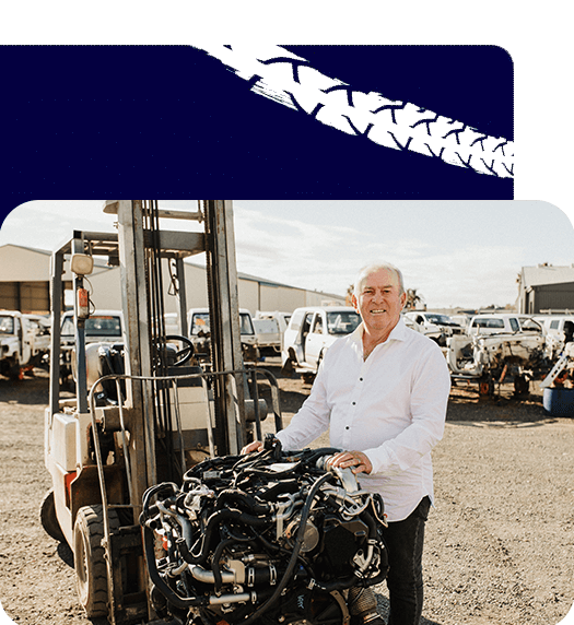 Man Holding Engine Parts — Spare Parts in Dubbo, NSW