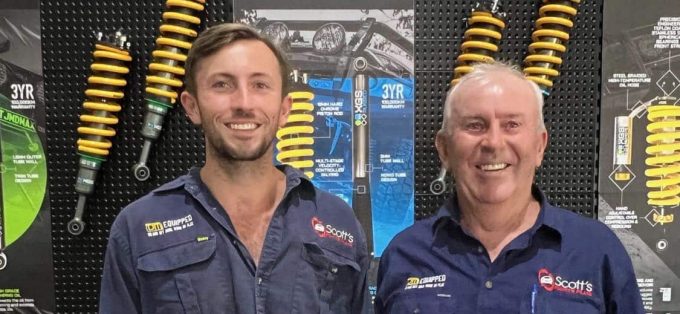 2 Happy Man Wearing Company Uniform — Spare Parts in Dubbo, NSW